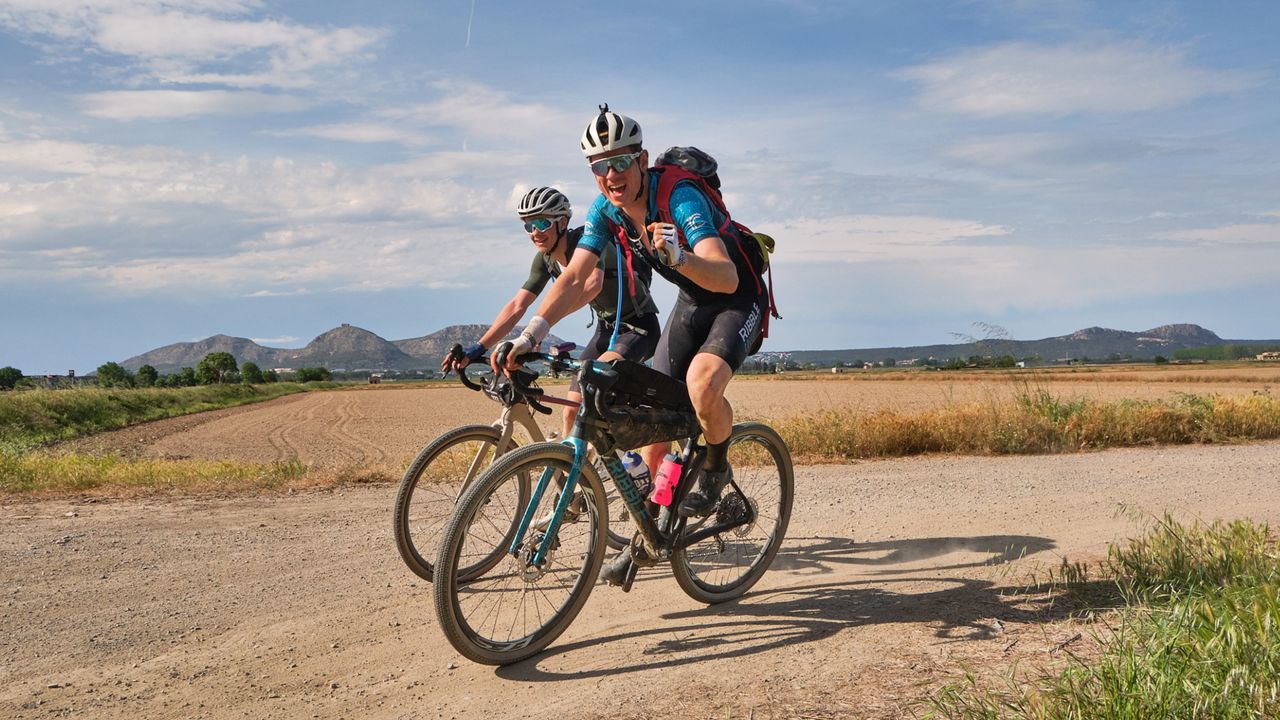 Tom Couzens smiling while riding The Traka 360 in Girona