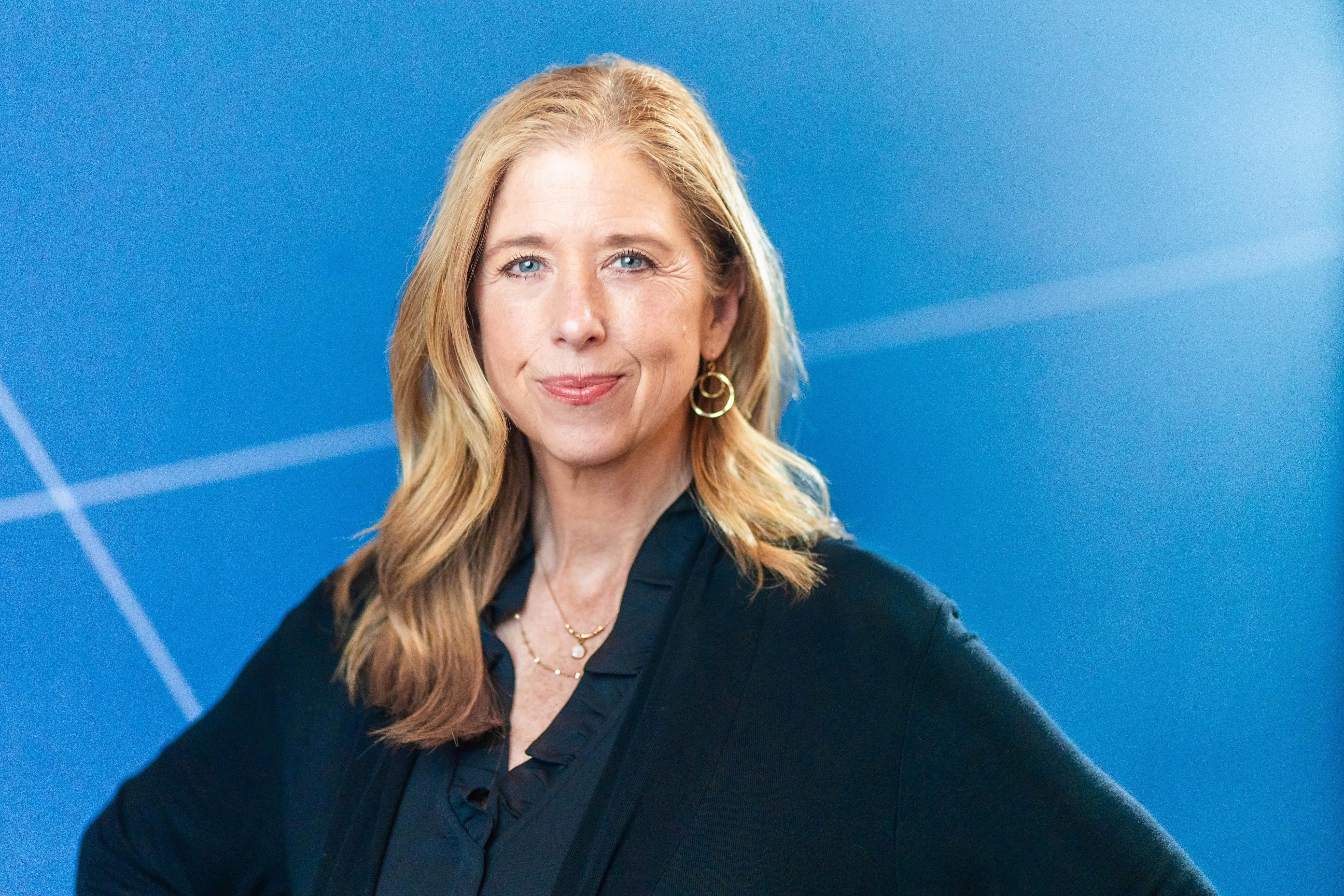 Kim Adams, VP of game development at Pokemon Go in front of a blue background