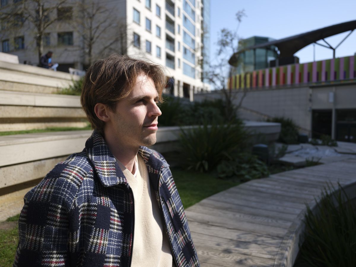 Fujifilm GFX100 RF sample images &ndash; portrait of a man sitting in the city sun