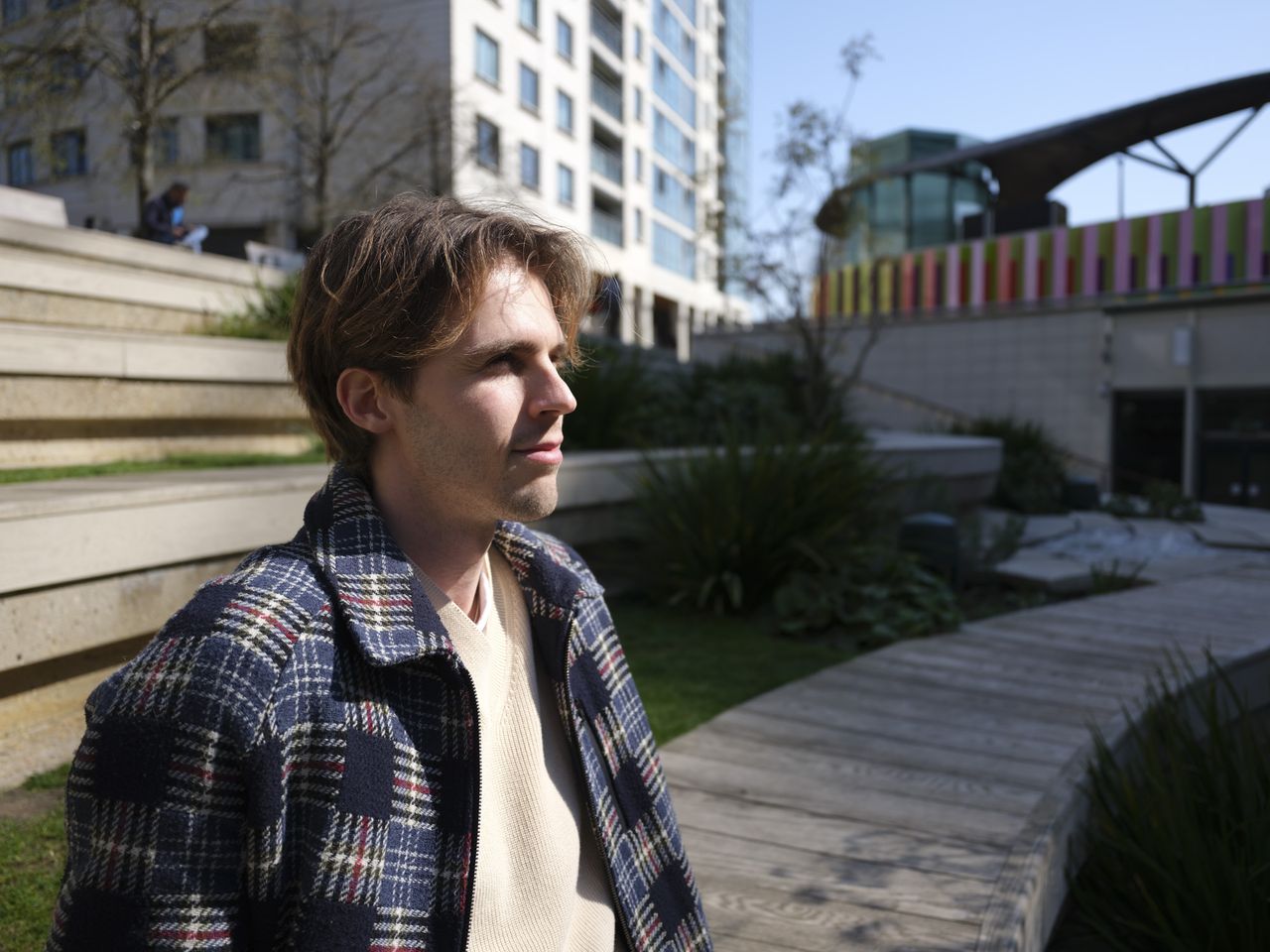 Fujifilm GFX100 RF sample images &ndash; portrait of a man sitting in the city sun