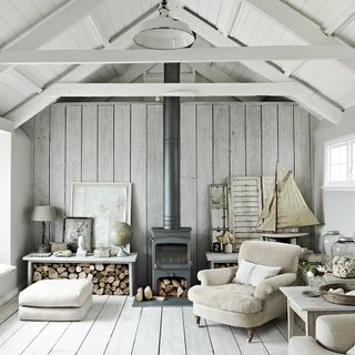 White living room with natural materials and log burner