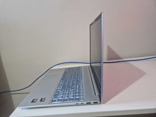 A silver HP Pavilion 16 sitting on a white desk