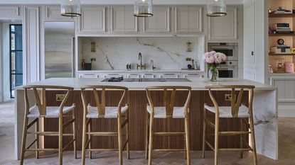 David Gandy kitchen with island and wishbone stools