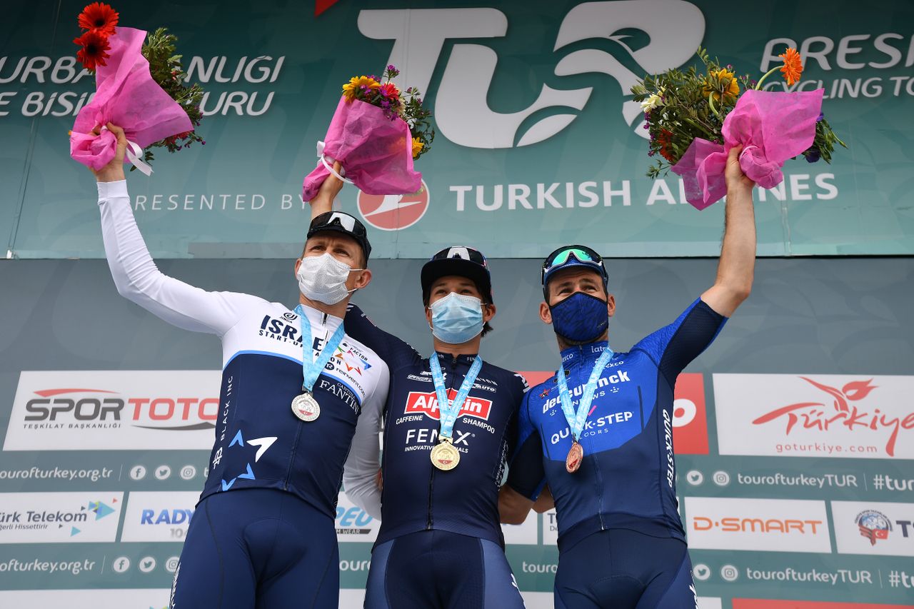 TURGUTREIS TURKEY APRIL 17 Andre Greipel of Germany and Team Israel StartUp Nation Jasper Philipsen of Belgium and Team AlpecinFenix Mark Cavendish of United Kingdom and Team Deceuninck QuickStep celebrate at Podium during the 56th Presidential Cycling Tour Of Turkey 2021 Stage 7 a 180km stage from Marmaris to Turgutreis TUR2021 tourofturkeyTUR on April 17 2021 in Turgutreis Turkey Photo by Stuart FranklinGetty Images
