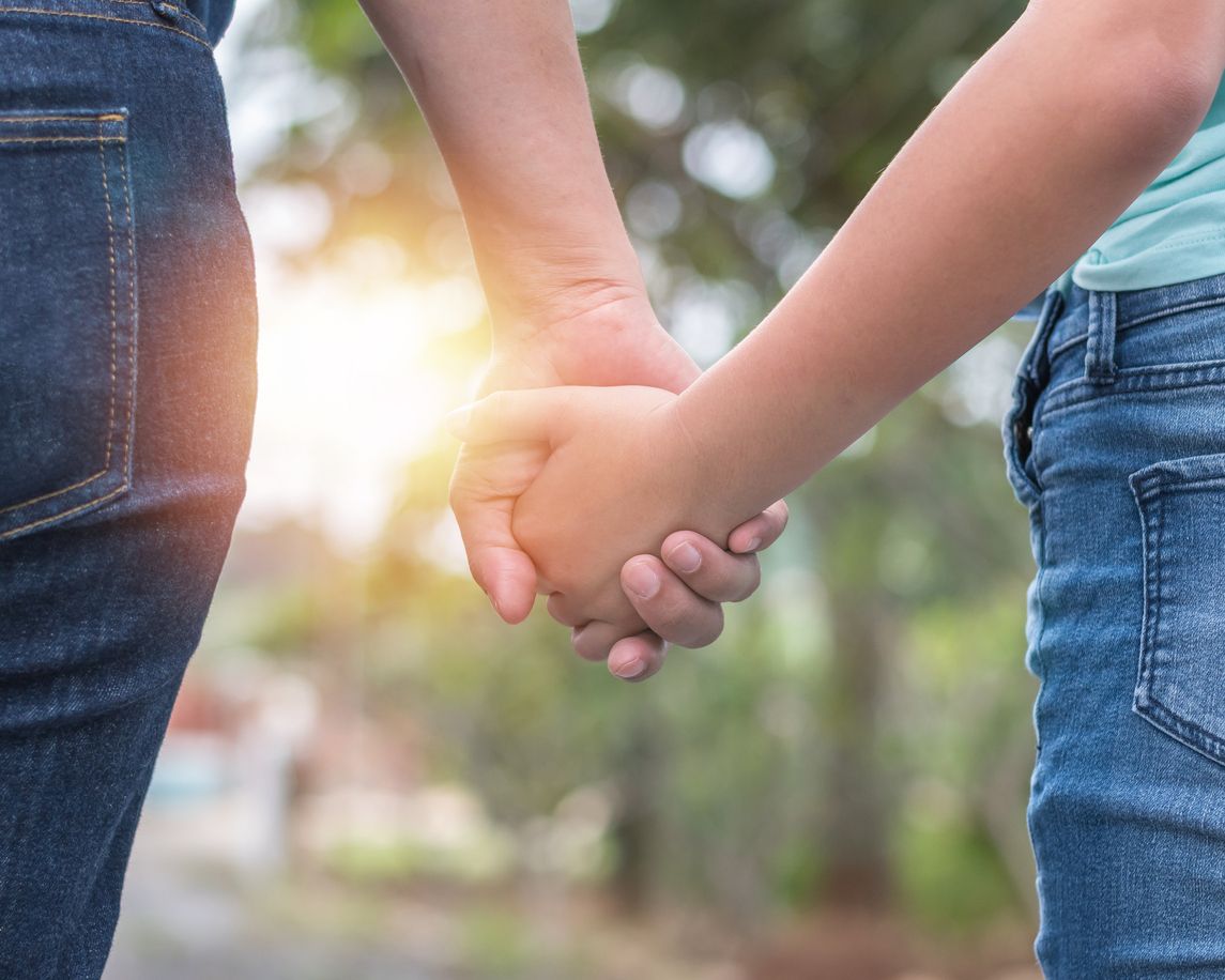 Two people holding hands.