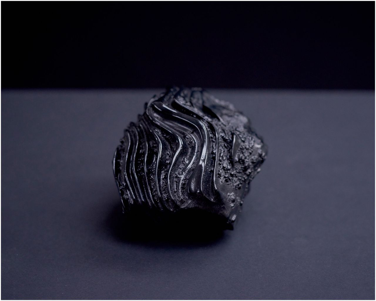 A black bronze cast of microbial dark matter