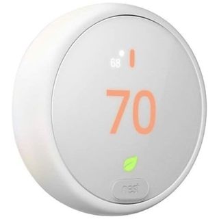 A white circular smart thermostat with orange digits