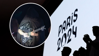 Spectators applaud during the Closing Ceremony of the Olympic Games Paris 2024 at Stade de France on August 11, 2024 in Paris, France with a smaller image of a cloaked guitarist