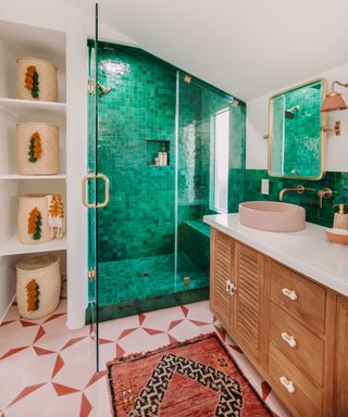 Small bathroom with green mosaic tiled shower