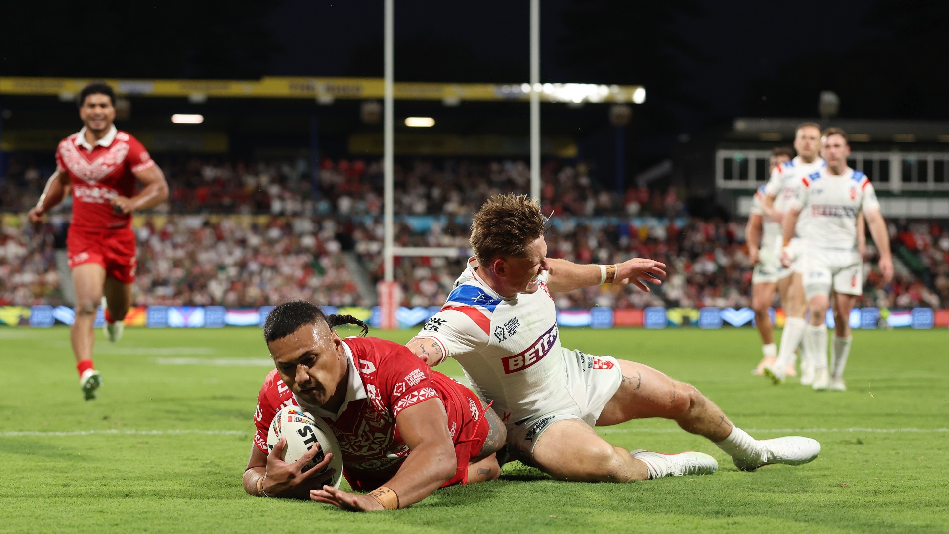 Tonga's Haumole Olakau'atu scoring a try against England at Rugby League World Cup 2026