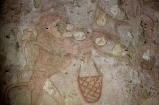 This painting from Hetpet's tomb shows a monkey reaping fruit. There appears to be a baby monkey holding onto its back.