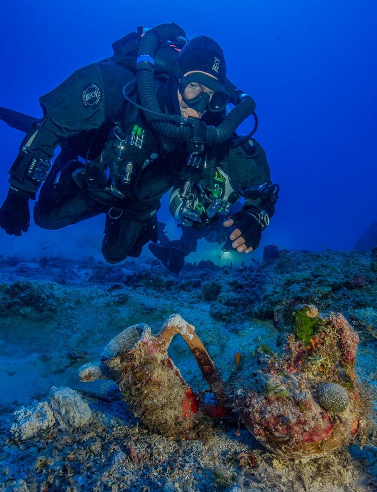 An archaeologist dives at the site of the Antikythera shipwreck.