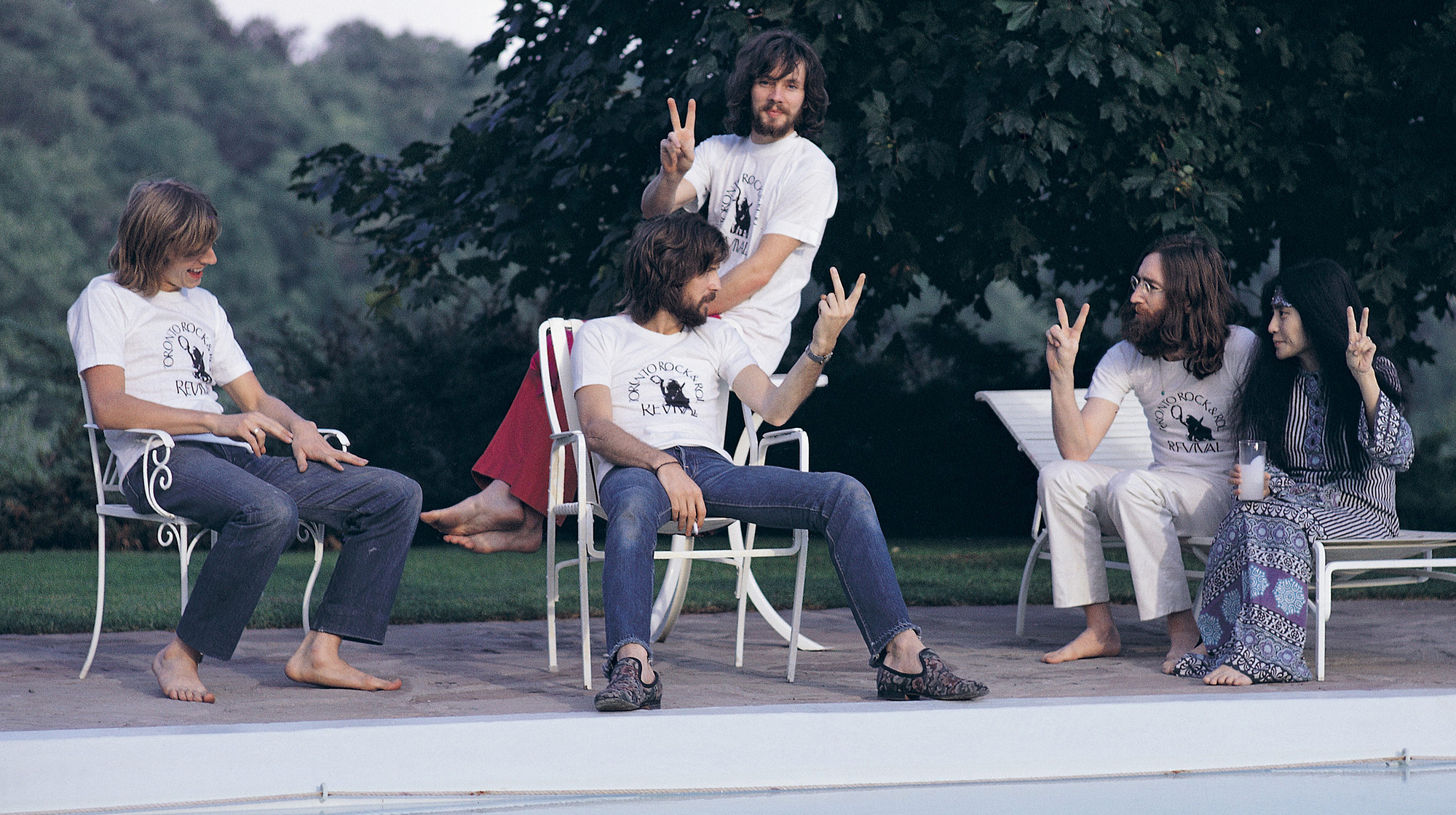 Plastic Ono Band headlined the Toronto Rock 'n' Roll Revival show at Varsity Stadium, Toronto, September 1969. Left to right: drummer Alan White, Eric Clapton (seated), bassist Klaus Voorman, John Lennon and Yoko Ono.
