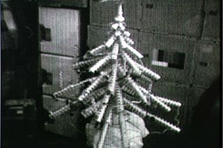 The first American Christmas holiday aboard a space station occurred in 1973 during the Skylab 4 mission to the first American space station Skylab. The station's three-man crew saved up their food cans to create this space Christmas tree.