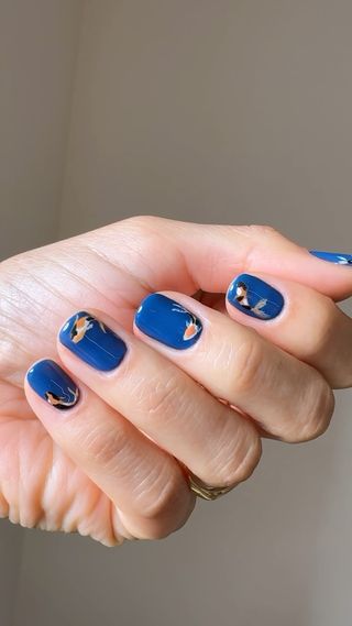 Blue nails with fish micro nail art