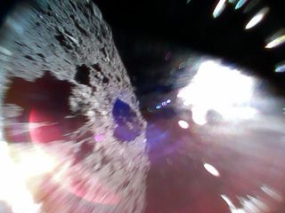 This spectacular photo shows the view from asteroid Ryugu from the Minerva-II1A rover during a hop after it successfully landed on Sept. 21, 2018. The probe is one of two that landed on Ryugu from the Japanese Aerospace Exploration Agency's Hayabusa2 spac