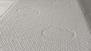 Close up of Puffy Deluxe Mattress Topper cover