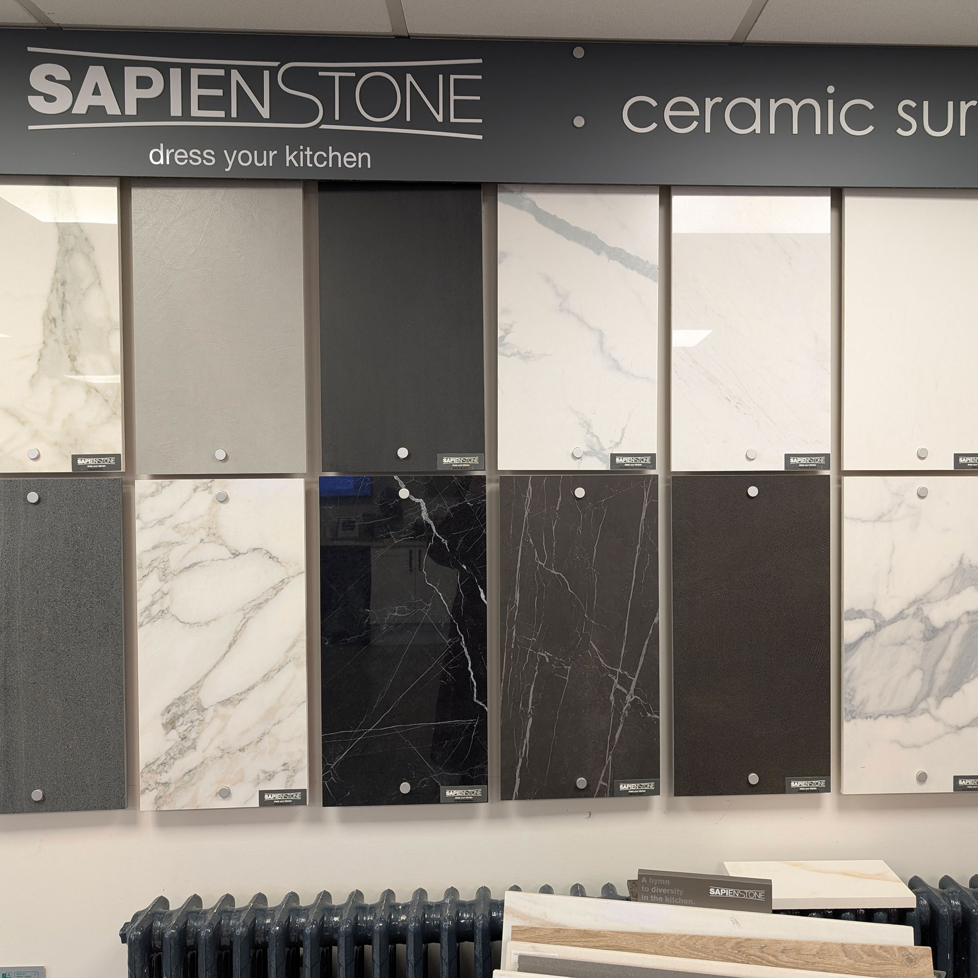 Large slabs of stone against wall in showroom