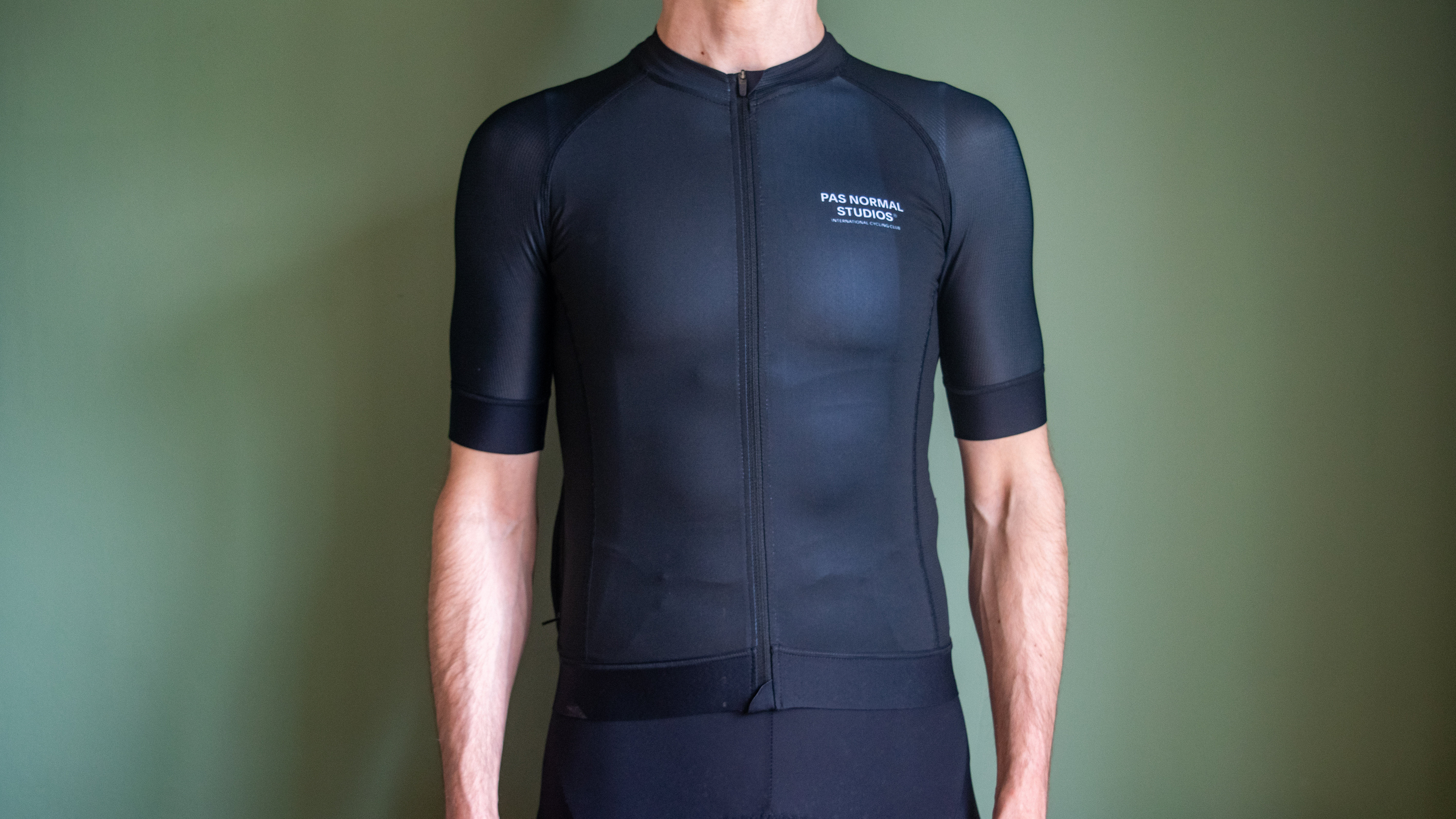 A man wearing a black PNS Mechanism jersey 