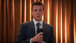 Frankie Muniz on a stage with a mic in Malcolm in the Middle: Life's Still Unfair