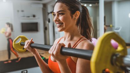 Woman working out with a barbell