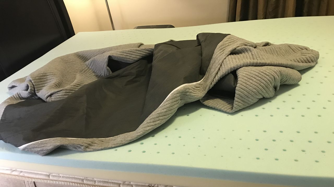 The unboxed Casper Comfy Mattress Topper cover on the uncovered foam.