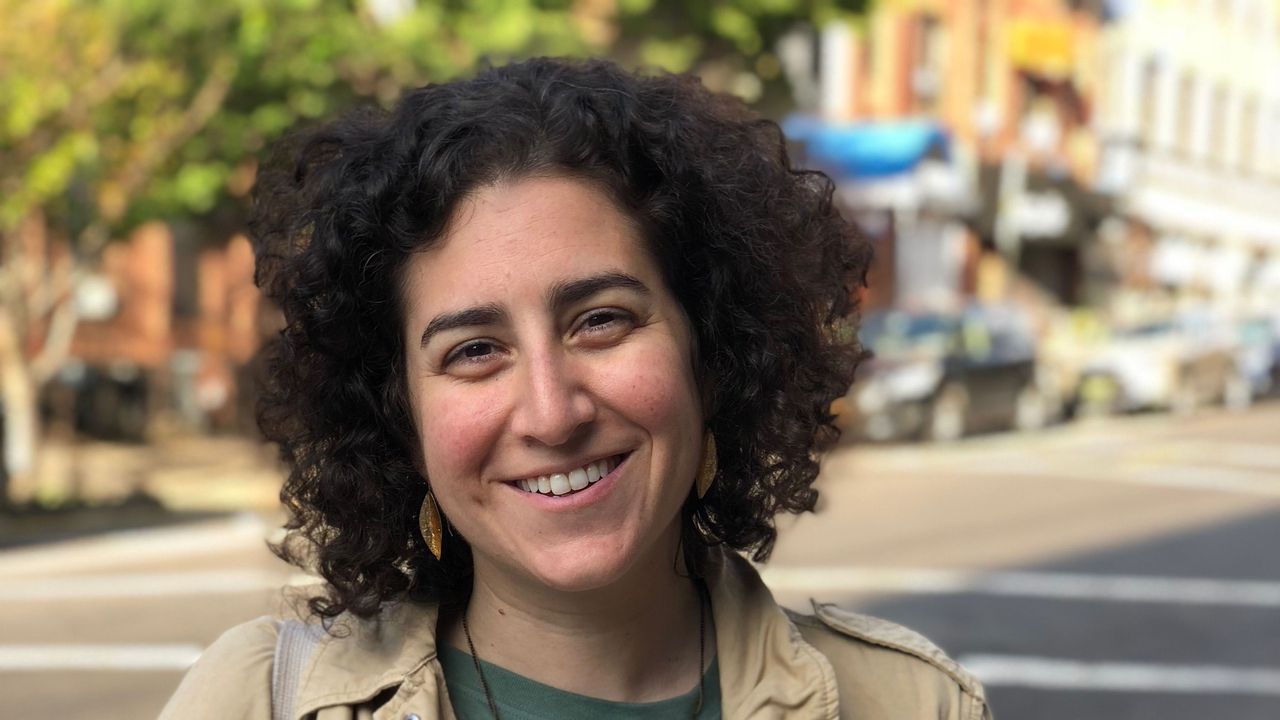 Happy, Street fashion, Publication, Khaki, Jheri curl, Book, Laugh, Necklace, Ringlet, Reading, 