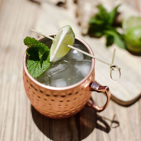 Mint julep, Moscow mule, Drink, Cocktail garnish, Lime, Caipirinha, Mojito, Plant, Herb, Food, 