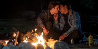 George Sear and Michael Cimino kissing in front of a fire as Benji and Victor in Love, Victor