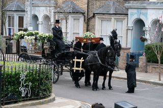 Dot's funeral- black horses and carriage carrying Dot Cotton's coffin