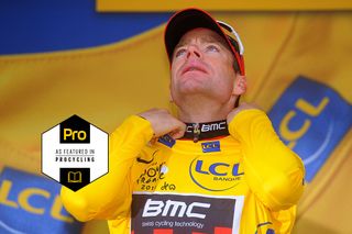 BMC's Cadel Evans pulls on the yellow jersey after second place – behind Tony Martin – on stage 20 time trial at the 2011 Tour de France. They next day, he'd be confirmed at Australia's first Tour winner