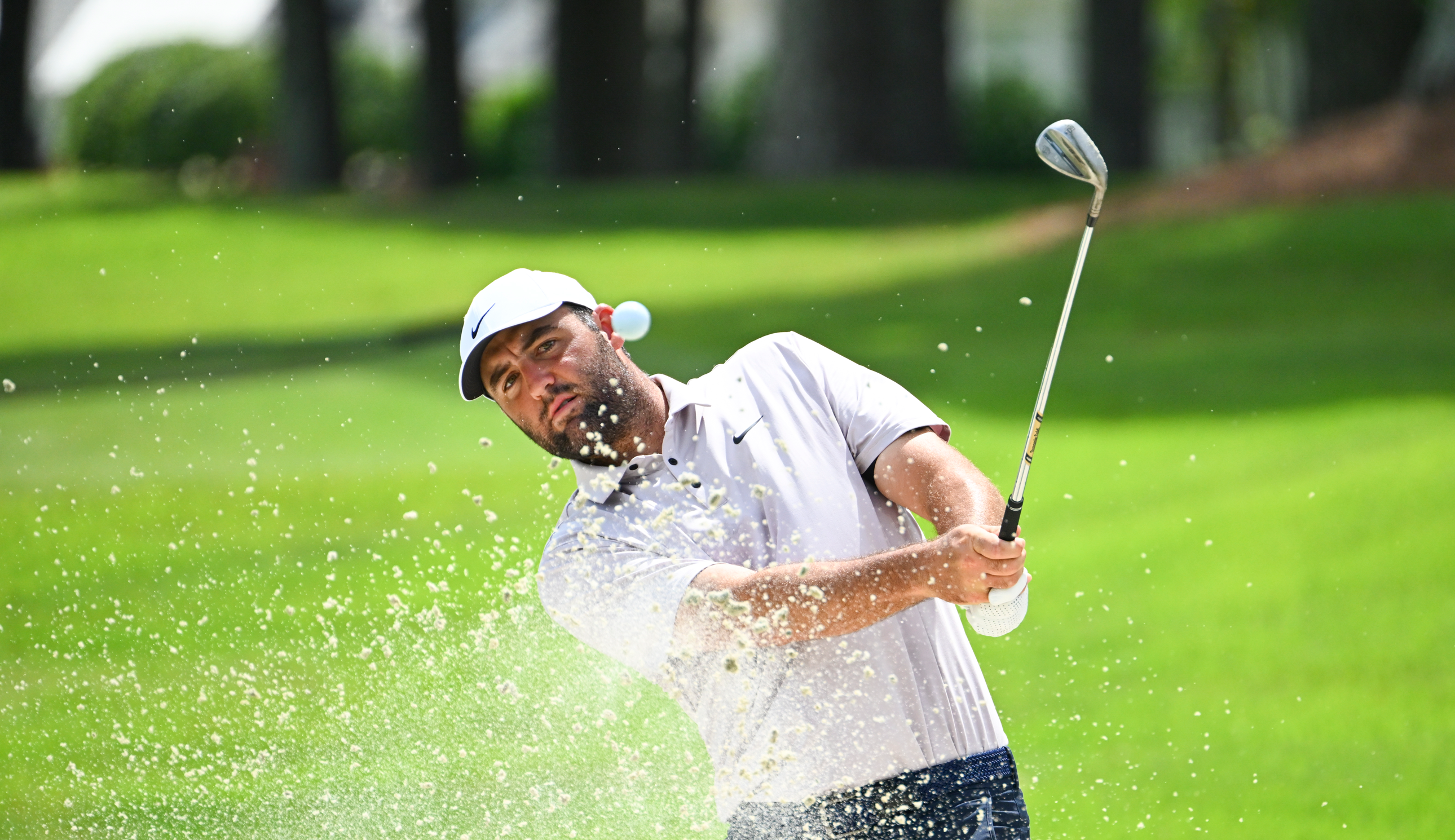 Scottie Scheffler hits a bunker shot