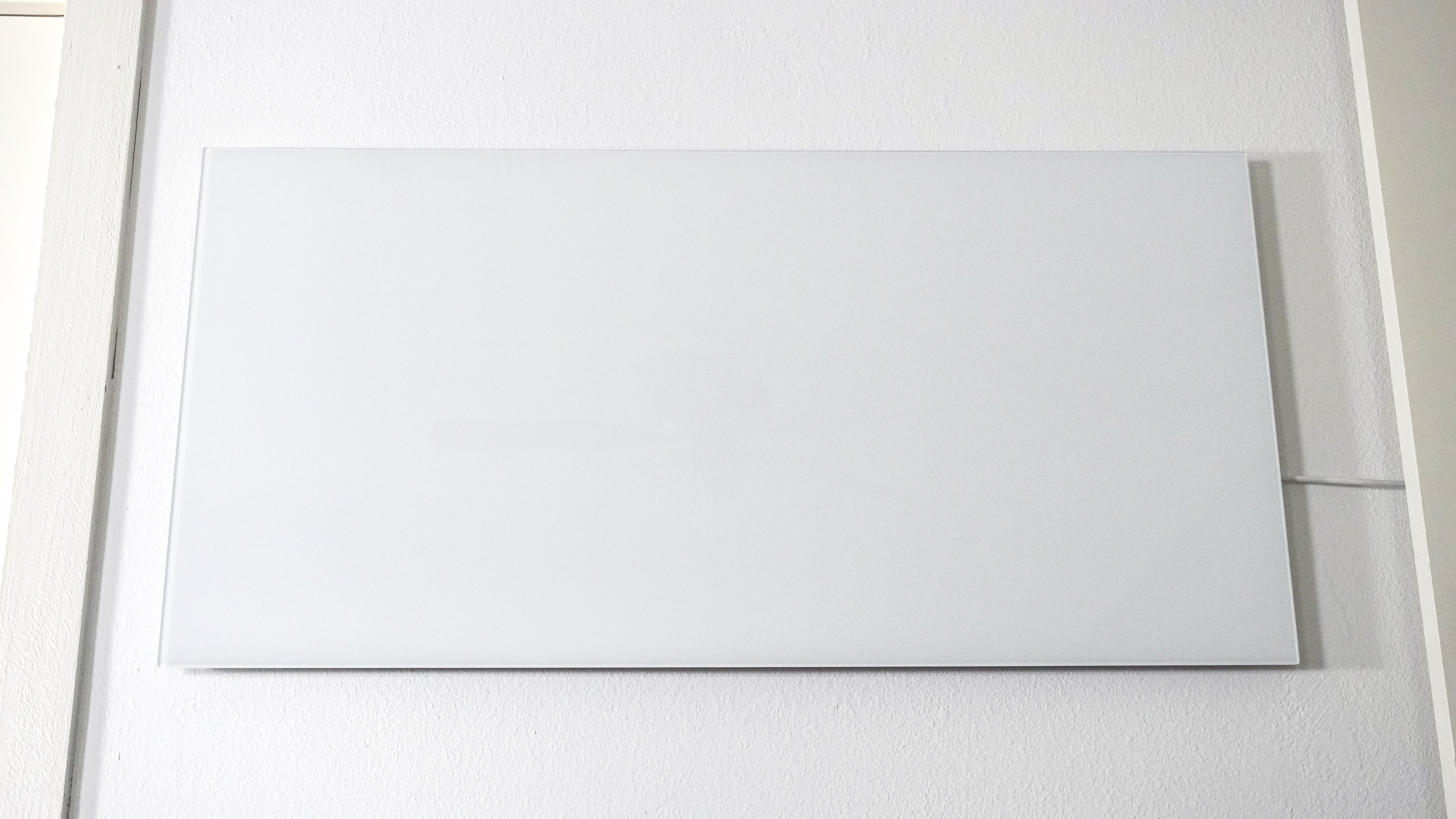 The Boldr Kelvin infrared heater mounted on a wall