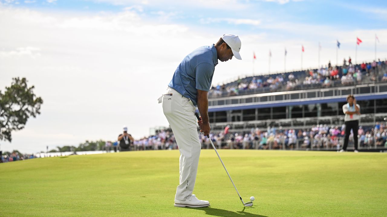 Tiger Woods hits a chip at the US Open