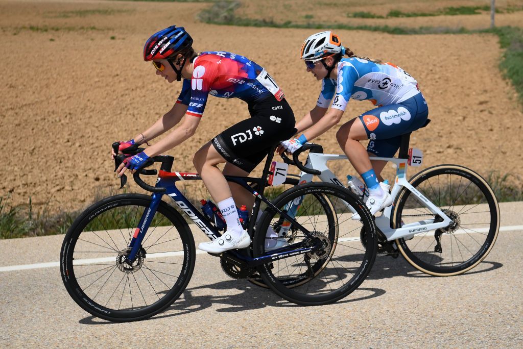 VINUESA SPAIN MAY 03 LR Evita Muzic of France and Team FDJ SUEZ and Juliette Labous of France and Team dsmfirmenich PostNL compete during the 10th La Vuelta Femenina 2024 Stage 6 a 1321km stage from Tarazona to La Laguna Negra Vineuesa 1722m UCIWT on May 03 2024 in Vineuesa Spain Photo by Alex BroadwayGetty Images