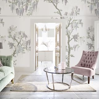 White living room with wallpaper and a mirror coffee table