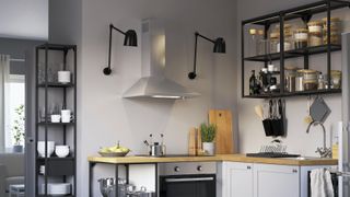 Grey kitchen with black open shelving to show smart small kitchen storage idea