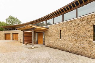 A Curved Oak Frame Home with Striking Entrance