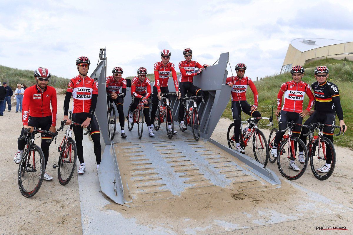 The Lotto Soudal riders stop at one of the D-Day monuments on Utah Beach