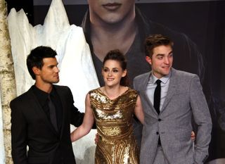 Actors Taylor Lautner, Kristen Stewart and Robert Pattinson attend the 'The Twilight Saga: Breaking Dawn Part 2' Germany premiere.