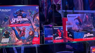 MTG Spider-Man products lined up on a glass shelf
