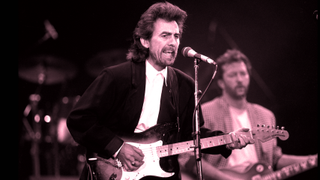 George Harrison performs with Eric Clapton during a concert for the Princes Trust, at Wembley Stadium, London, circa 1987 