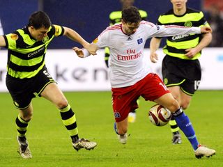 Celtic's Gary Caldwell and Hamburg's Marcus Berg battle for the ball during a 2009 Europa League match