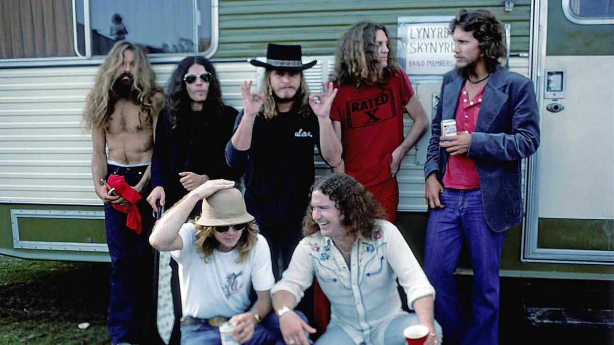 Lynyrd Skynyrd pose by their trailer backstage at an outdoor concert in October, 1976 in California