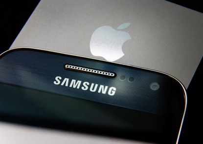 A Samsung smartphone alongside an Apple phone