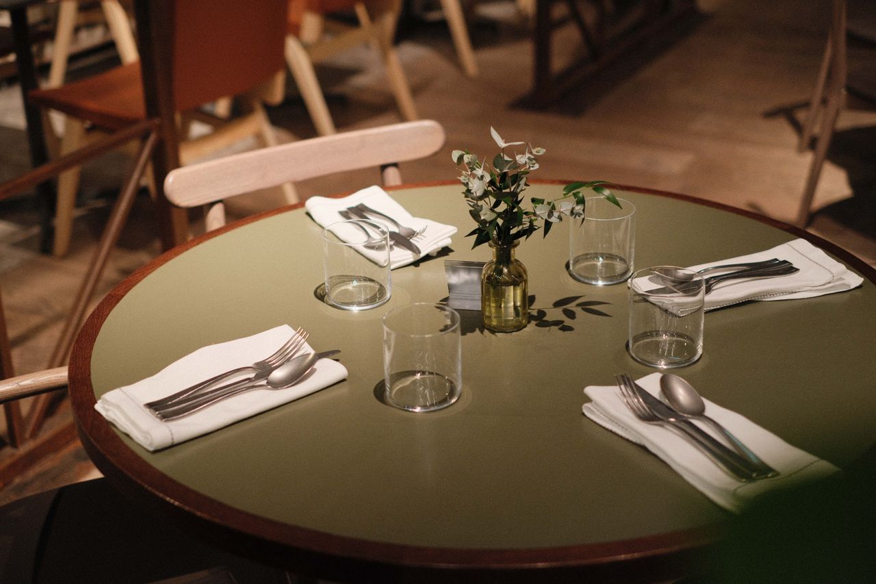 A table laid for dinners at a restaurant