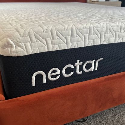Depth of Nectar mattress on bed frame with Nectar logo visible