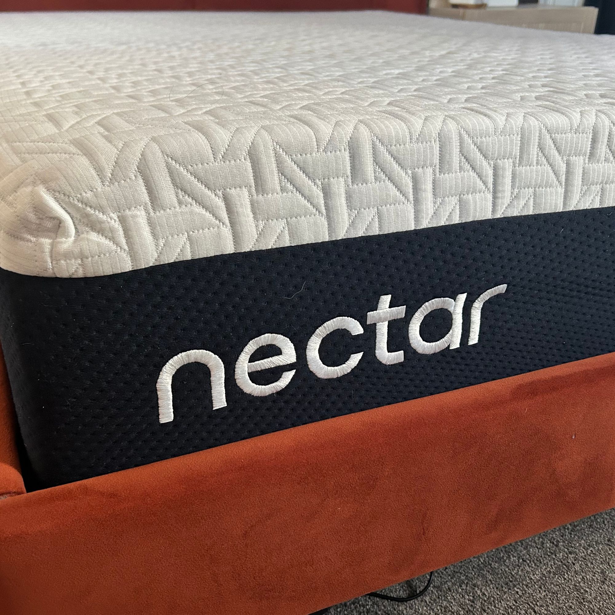 Depth of Nectar mattress on bed frame with Nectar logo visible