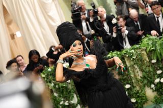 Cardi B wearing a very thick triangular manicure to the 2024 Met Gala.