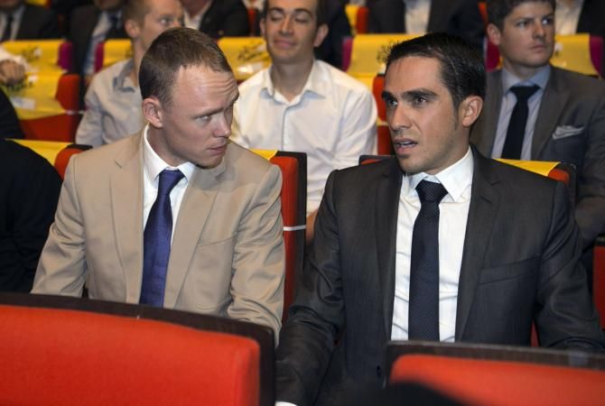 Chris Froome and Alberto Contador chat at the presentation of the 2014 Tour de France route